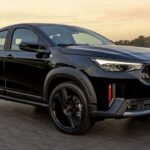 Fiat Pulse Abarth 2026 preto em movimento vista frontal lateral