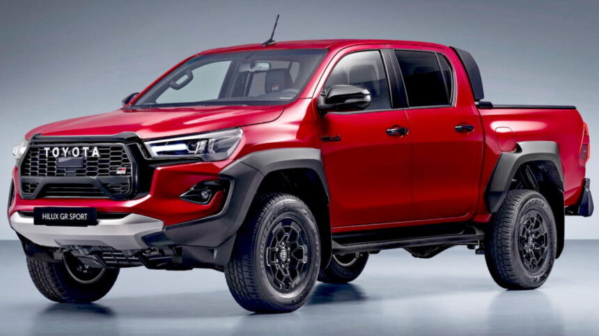 Toyota Hilux de entrada em tom prata, vista frontal 3/4 em estrada argentina, com foco na cabine simples e na caçamba
