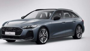 Audi A5 Avant e Audi A6 Avant e-tron lado a lado em vista lateral, em pátio de concessionária, landscape